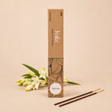 Kalla Tuberose Incense Sticks – eco-friendly brown packaging with artistic floral line designs and a white label marked “Tuberose,” displayed on a textured grey surface with incense sticks arranged neatly, surrounded by natural decorative elements for a serene and floral ambiance.
